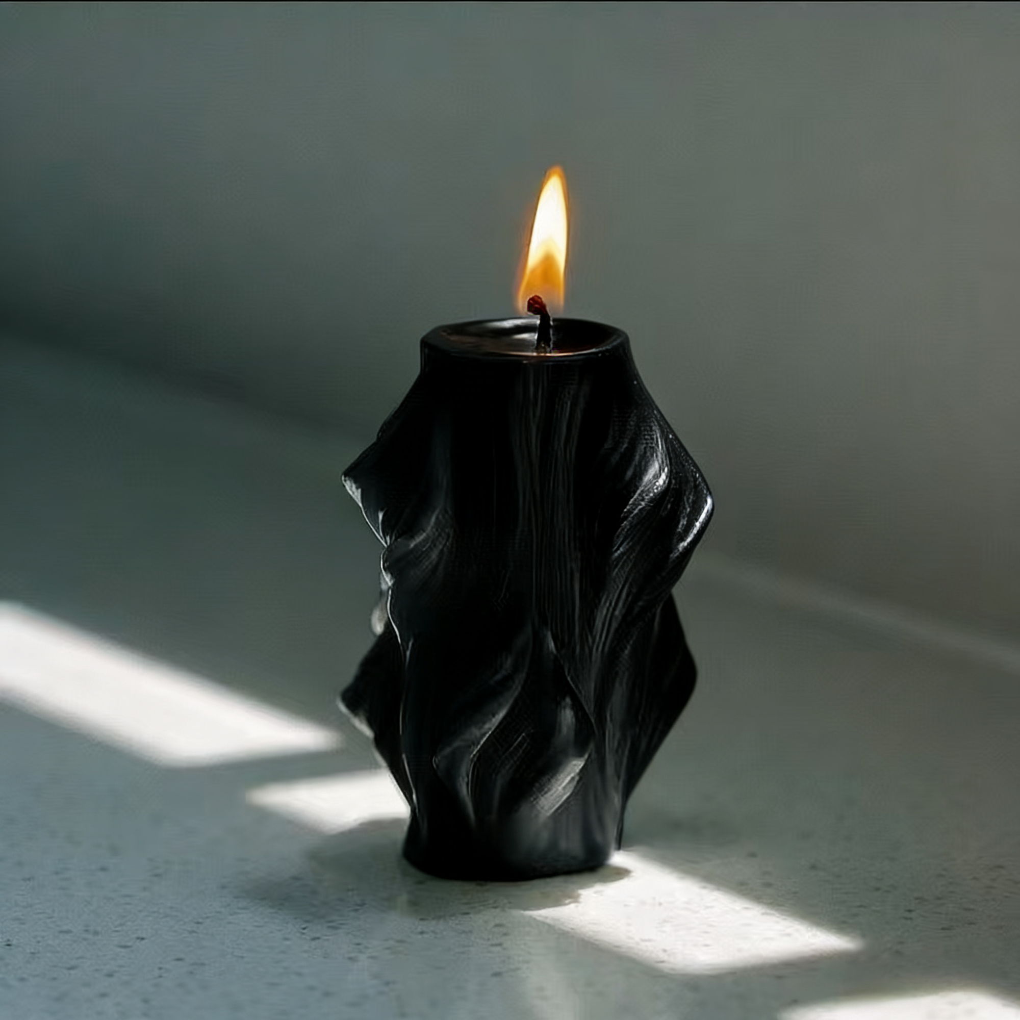 Decorative wave diamond column candle styled for a cozy room